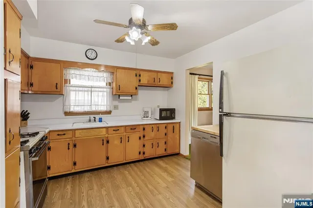 a bathroom with a sink a toilet and bathtub