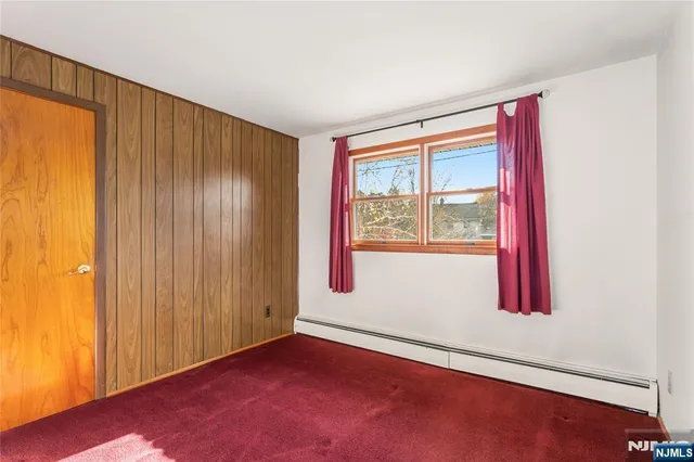 a view of a house with backyard and a garden