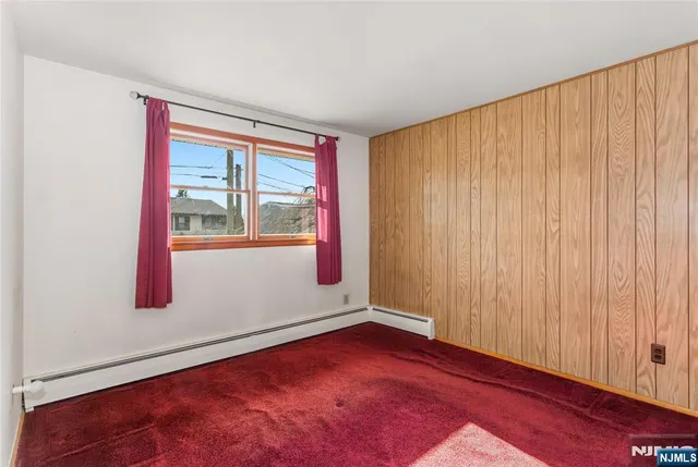 a view of a room with wooden walls