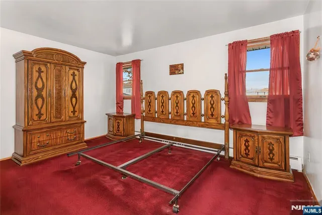 a view of a house with a yard and pathway