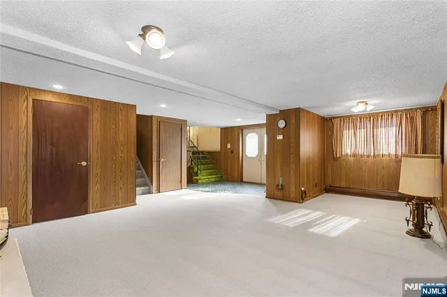 a bathroom with a sink shower and a mirror