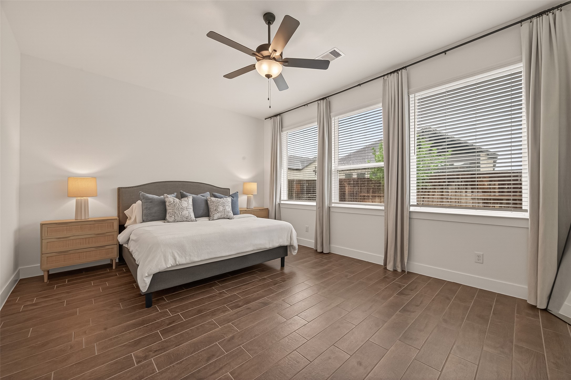 5019 Country Mdws Trail Rosharon, TX 77583 - Photo 30 of 49 a spacious bedroom with a bed and a large window