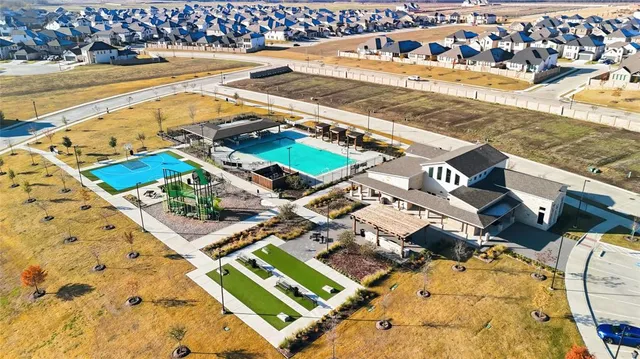 a view of swimming pool with outdoor seating