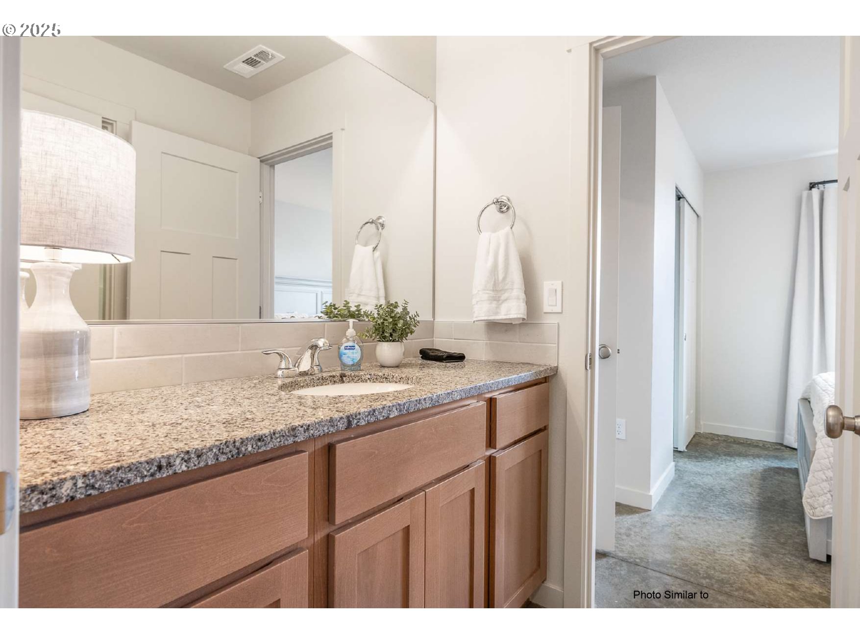 660 Jimmy Street Stanfield, OR 97875 - Photo 4 of 12 a bathroom with a sink vanity granite and a mirror