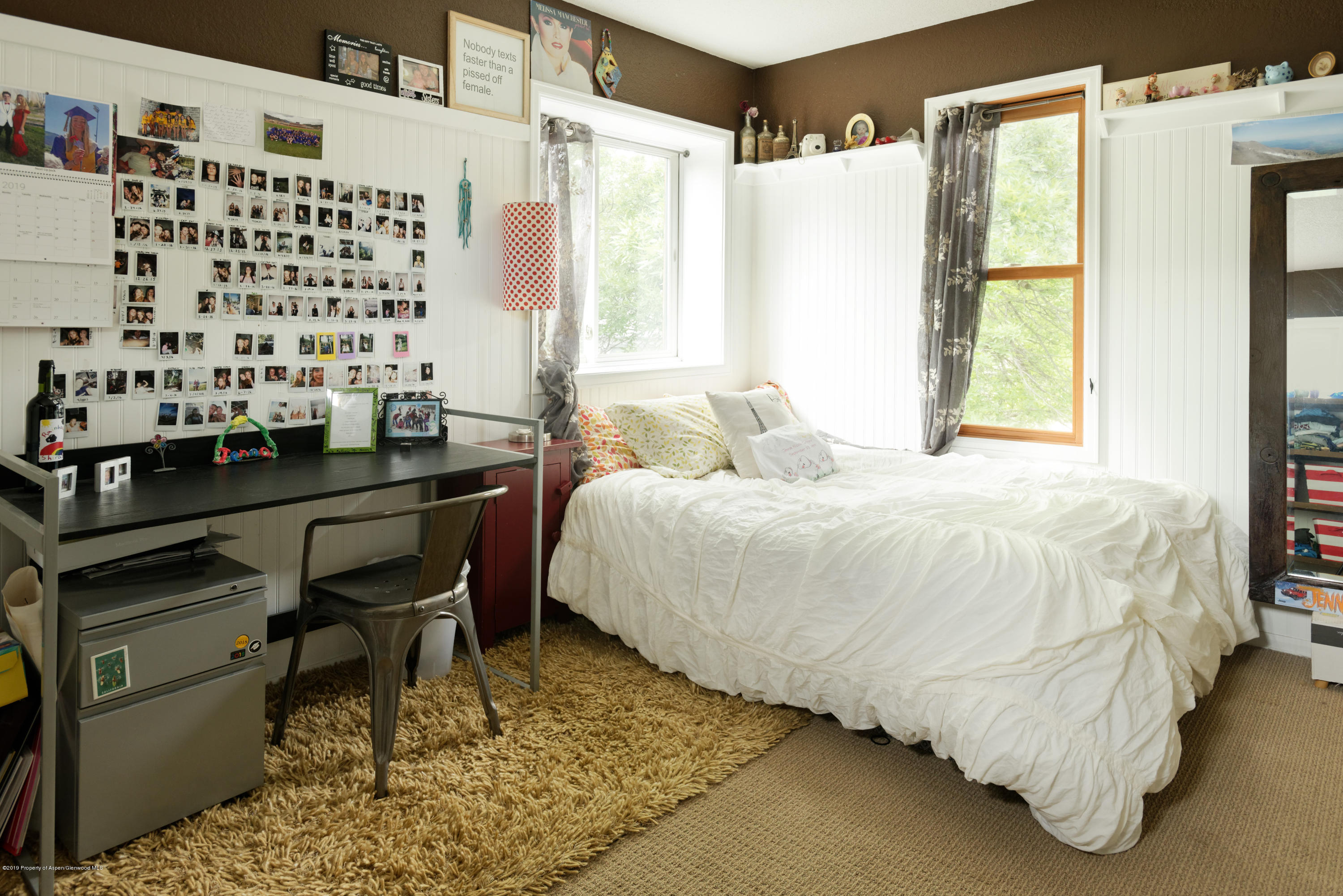 195 Riverside Drive Basalt, CO 81621 - Photo 20 of 38 a bedroom with a bed and a window
