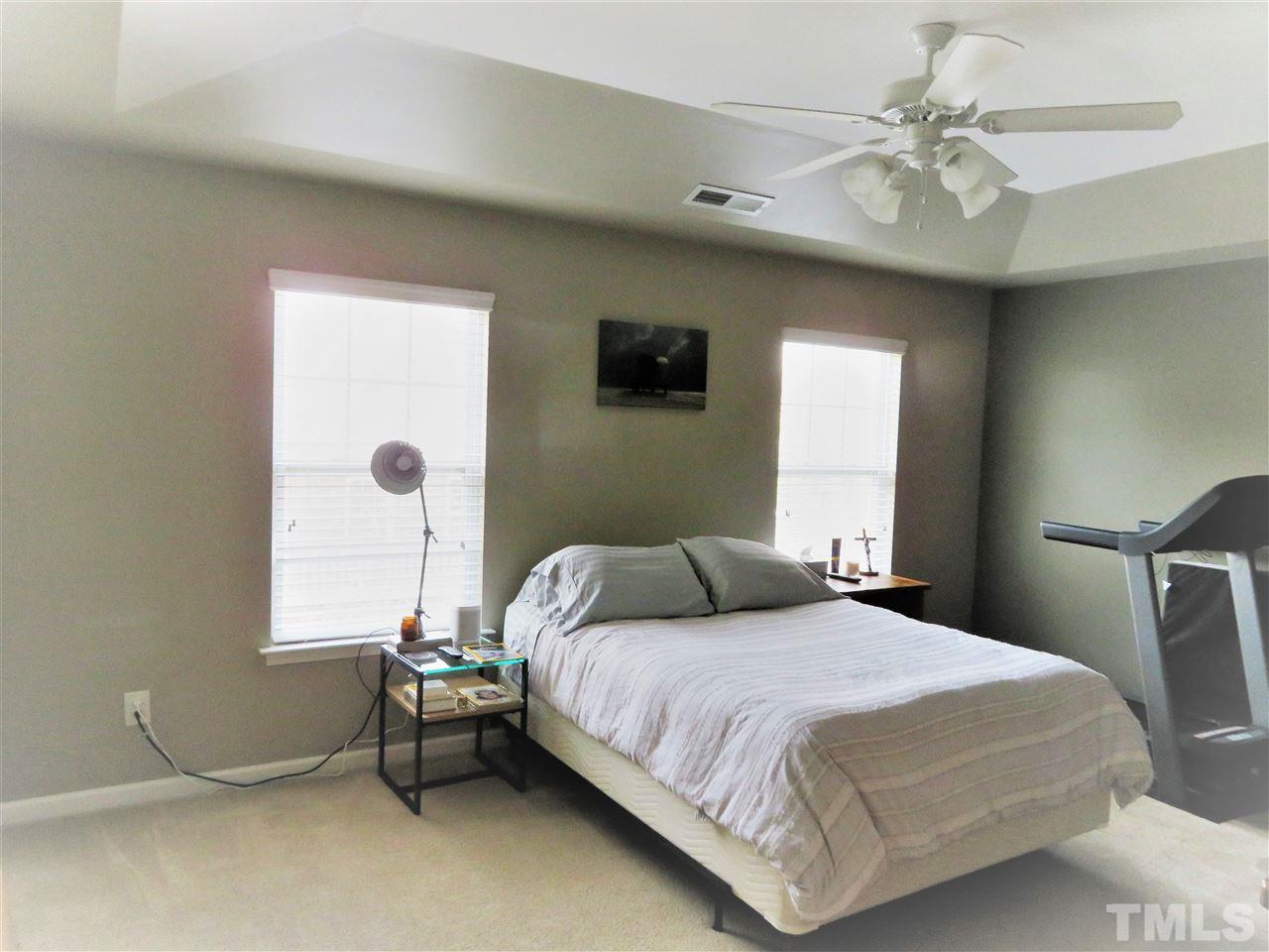 2442 Memory Ridge Drive Raleigh, NC 27606 - Photo 17 of 23 a bedroom with a bed and a window