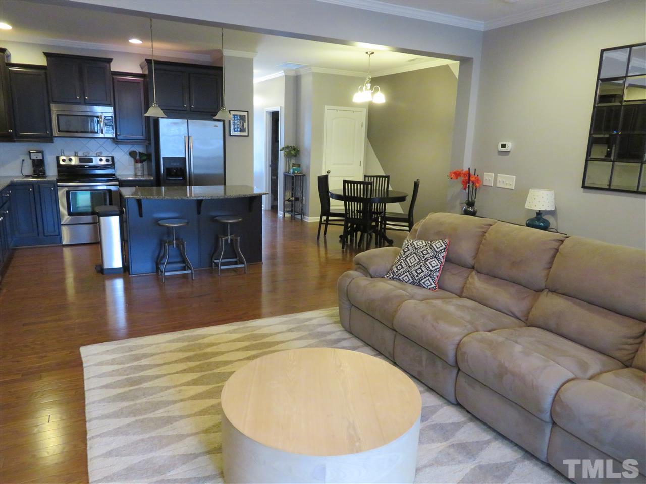 2442 Memory Ridge Drive Raleigh, NC 27606 - Photo 3 of 23 a living room with furniture and kitchen view