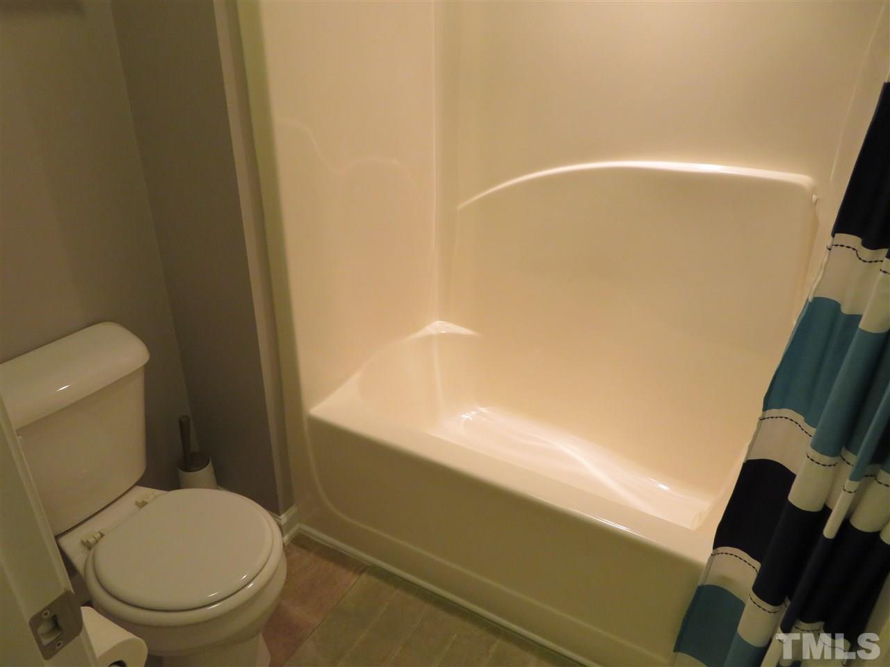 2442 Memory Ridge Drive Raleigh, NC 27606 - Photo 22 of 23 a bathroom with a toilet and a shower