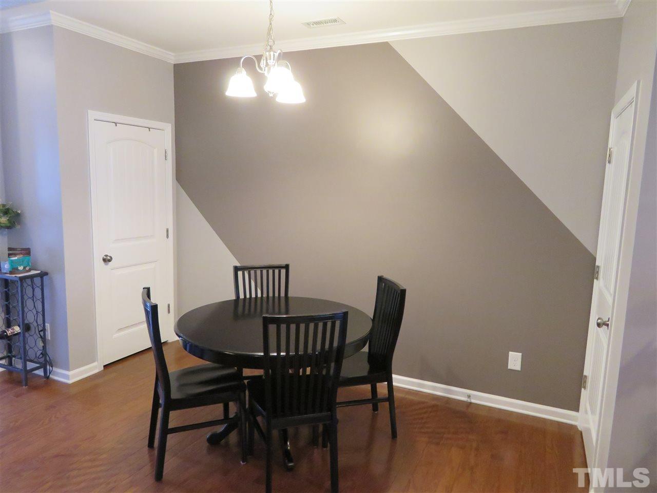 2442 Memory Ridge Drive Raleigh, NC 27606 - Photo 8 of 23 a view of a dining room with furniture and wooden floor