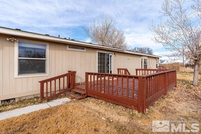 3745 Schindler Road Fallon, NV 89406 - Photo 15 of 16 a view of a deck with wooden floor and fence