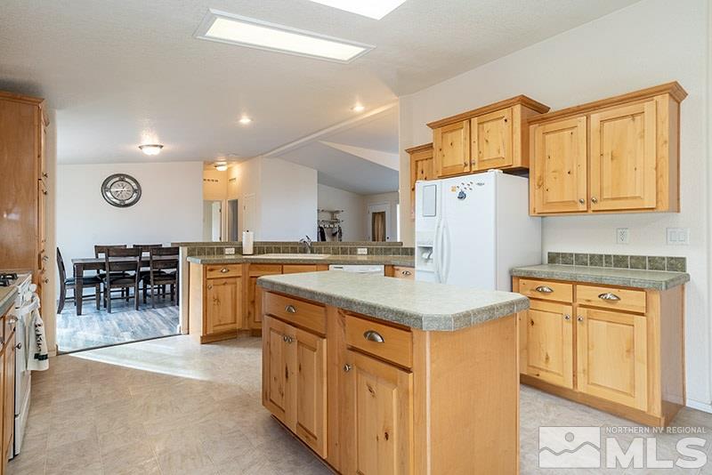 3745 Schindler Road Fallon, NV 89406 - Photo 6 of 16 a kitchen with cabinets and refrigerator
