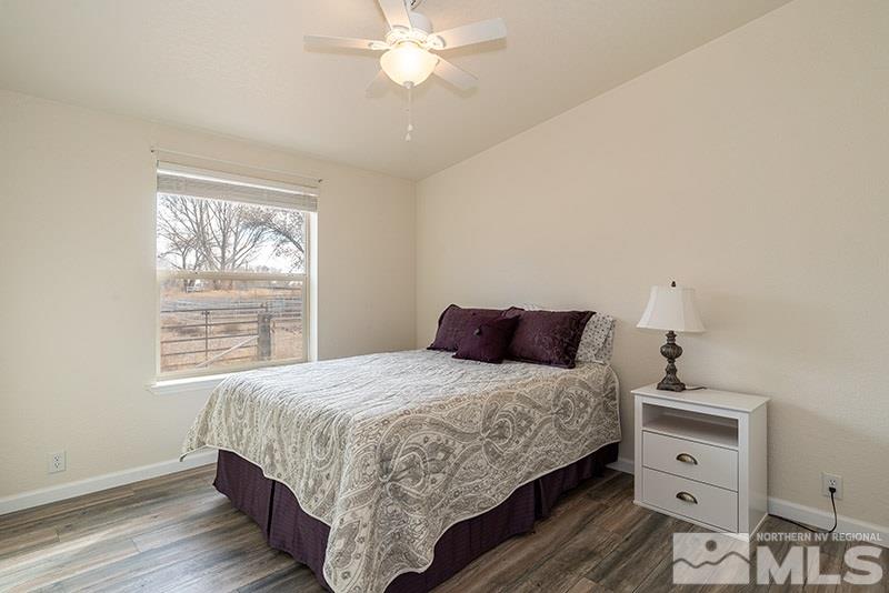 3745 Schindler Road Fallon, NV 89406 - Photo 8 of 16 a bedroom with a bed and a window