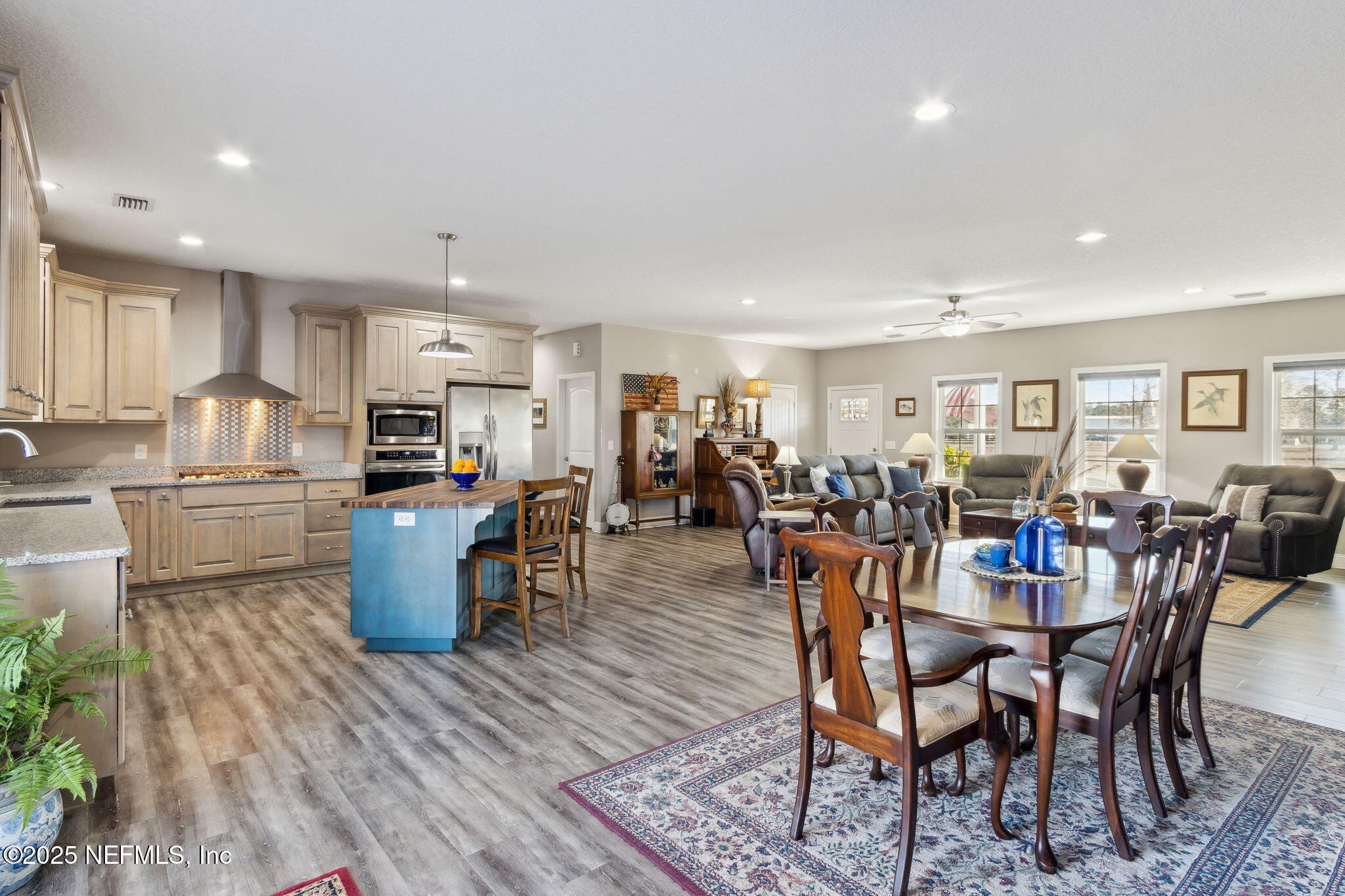 3303 Henry Lee Road Hilliard, FL 32046 - Photo 12 of 35 a view of a dining room with furniture and wooden floor