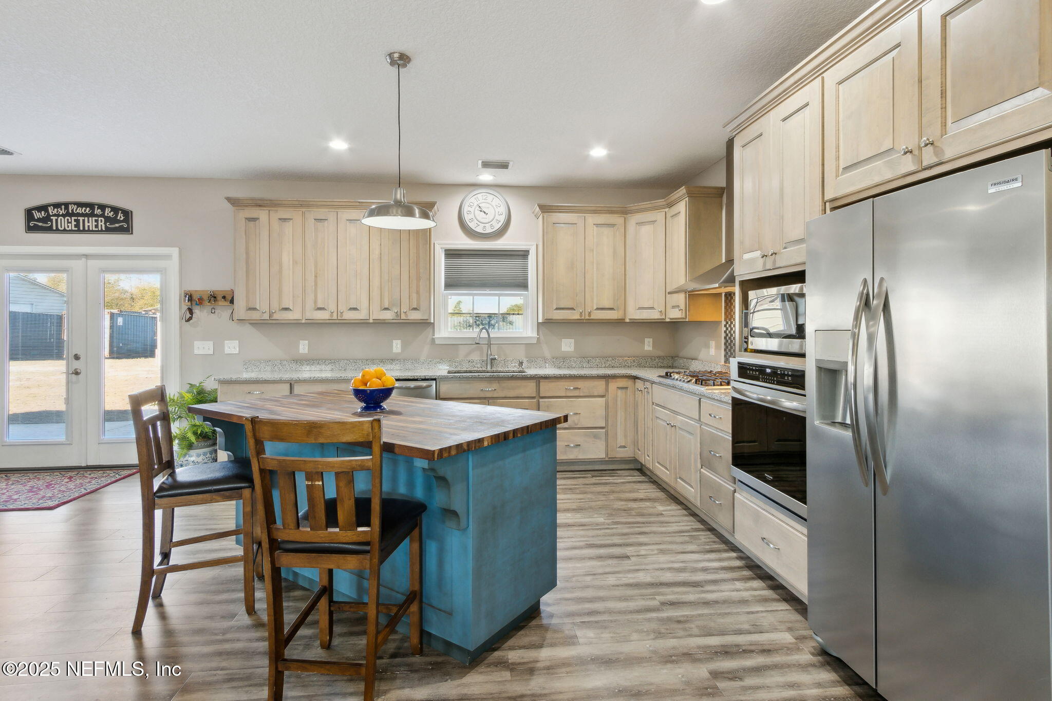 3303 Henry Lee Road Hilliard, FL 32046 - Photo 15 of 35 a kitchen with kitchen island granite countertop a sink and counter space