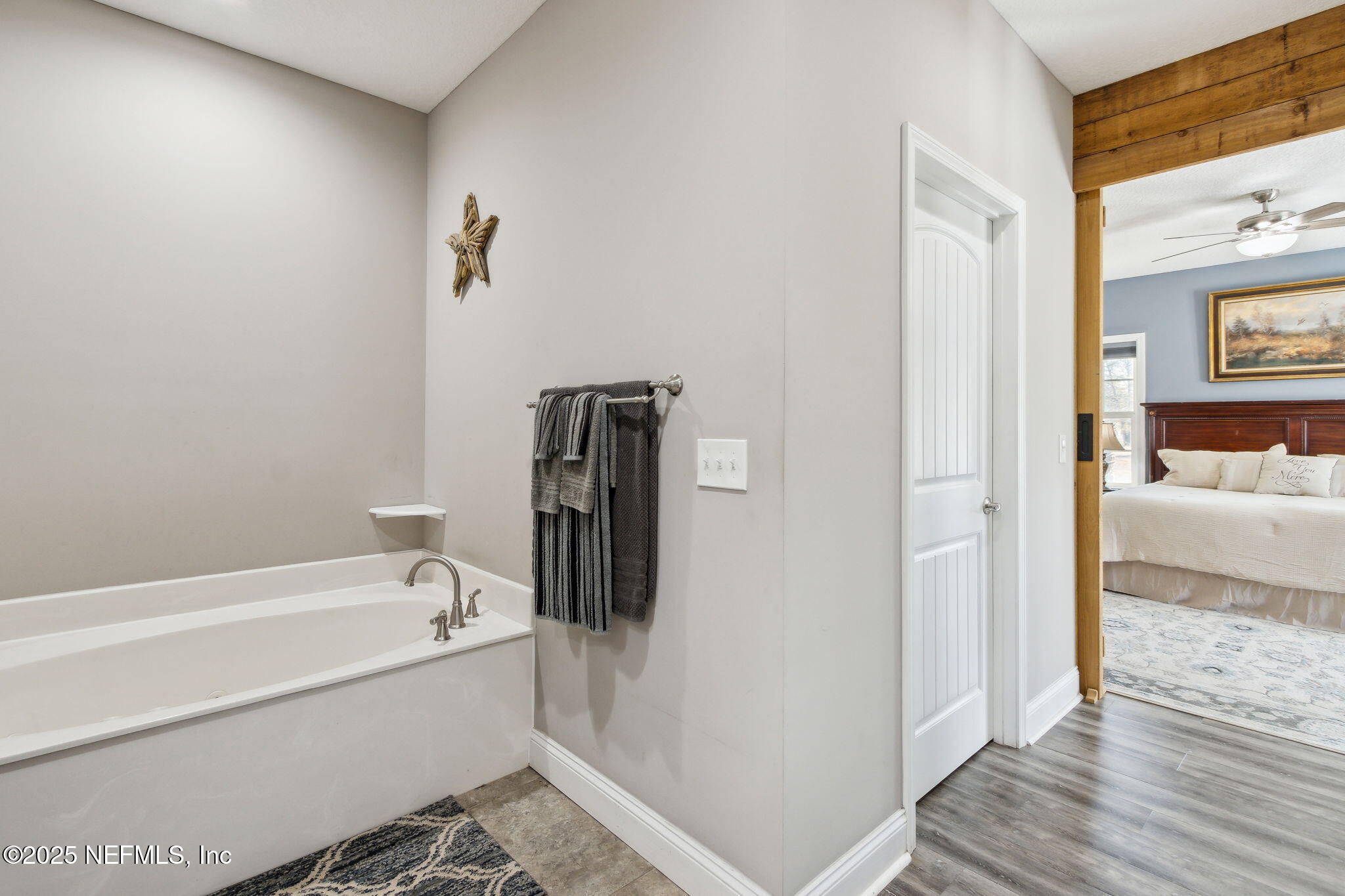 3303 Henry Lee Road Hilliard, FL 32046 - Photo 25 of 35 a bathroom with a tub and shower