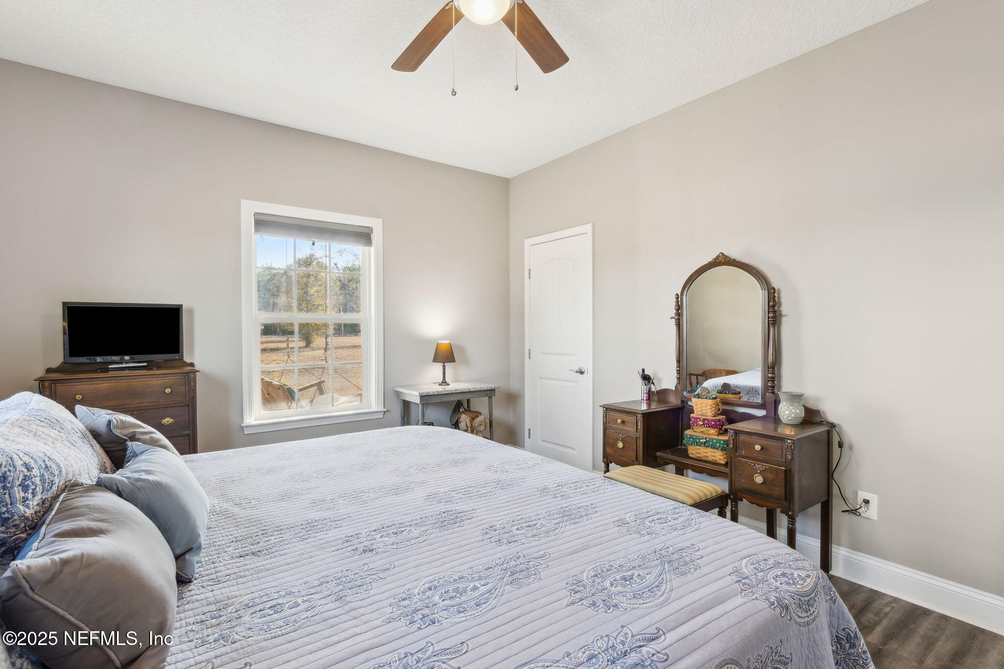 3303 Henry Lee Road Hilliard, FL 32046 - Photo 27 of 35 a bedroom with a bed and a flat screen tv