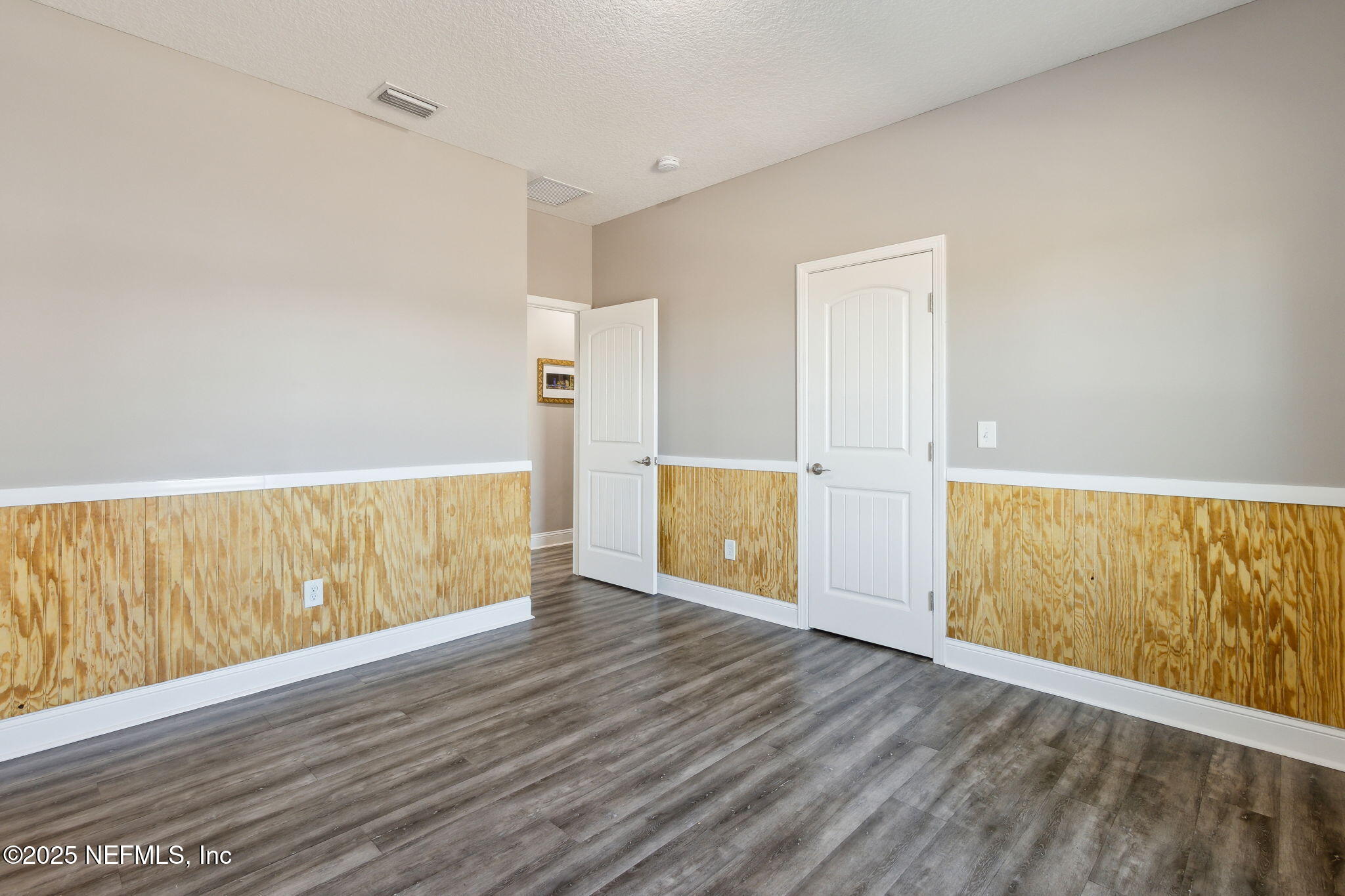 3303 Henry Lee Road Hilliard, FL 32046 - Photo 30 of 35 a view of an empty room with wooden floor