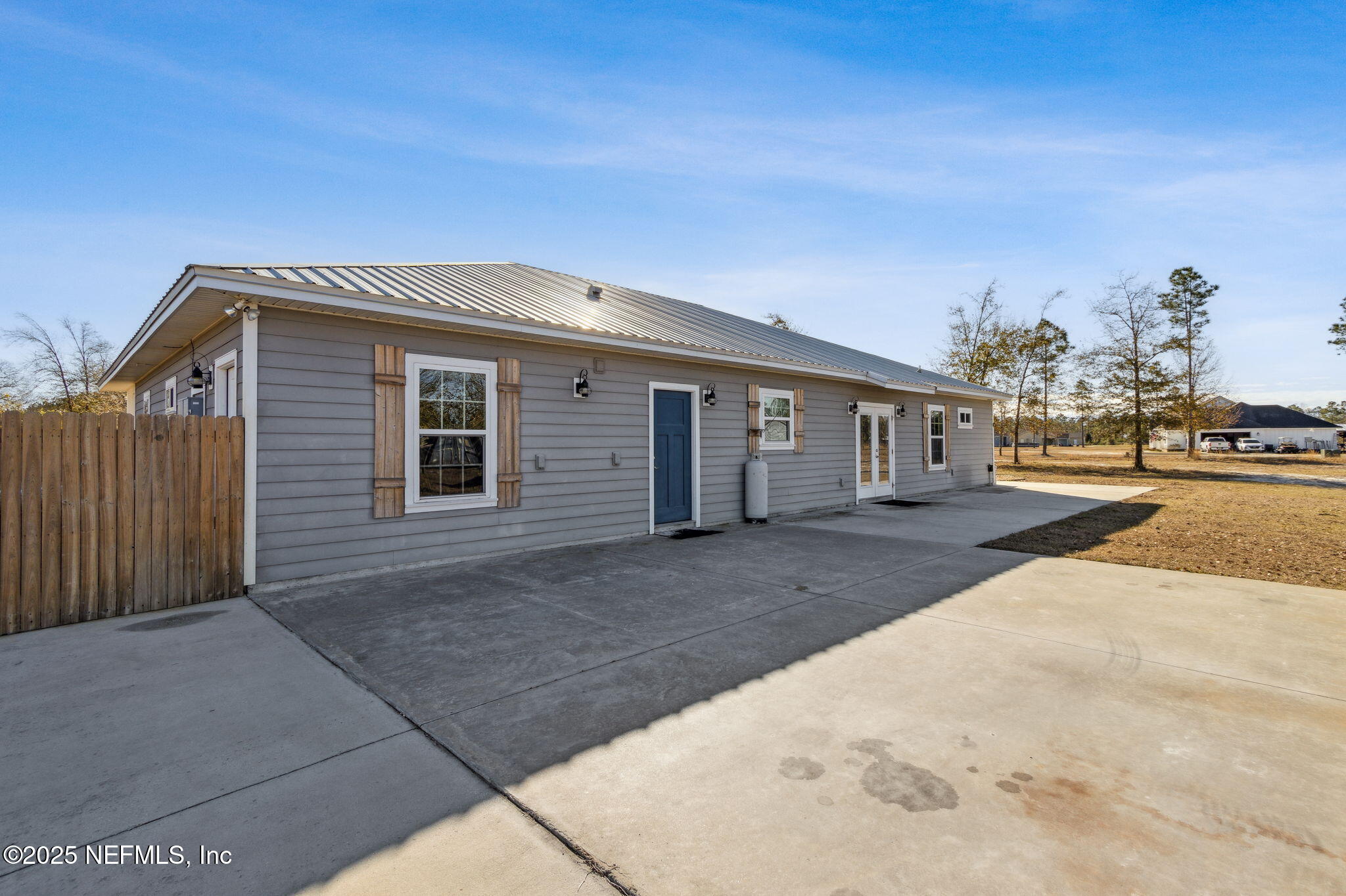 3303 Henry Lee Road Hilliard, FL 32046 - Photo 32 of 35 a view of a house with backyard