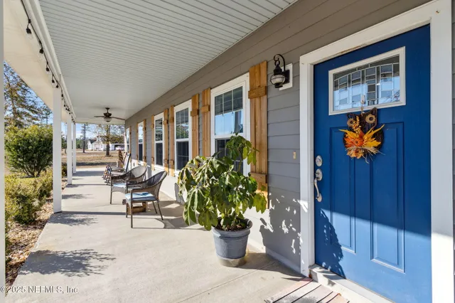 a lobby with furniture and potted plant