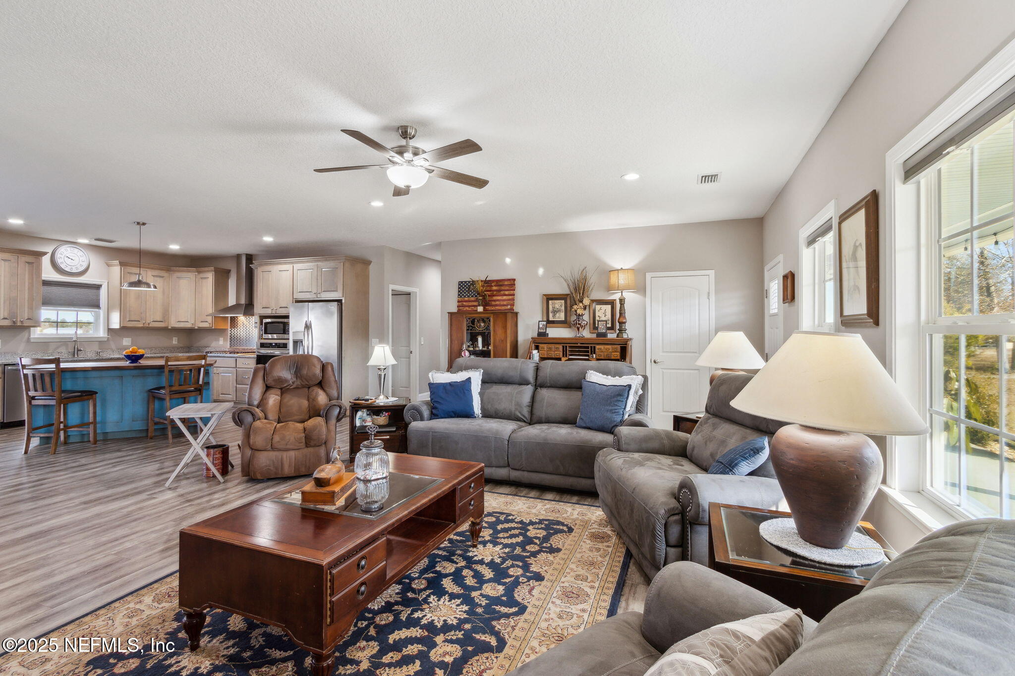 3303 Henry Lee Road Hilliard, FL 32046 - Photo 8 of 35 a living room with furniture kitchen view and a large window