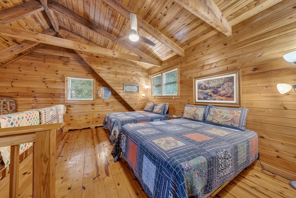 149 Mountain Springs Road Warm Springs, GA 31830 - Photo 25 of 43 a bed sitting in a spacious bedroom next to a window
