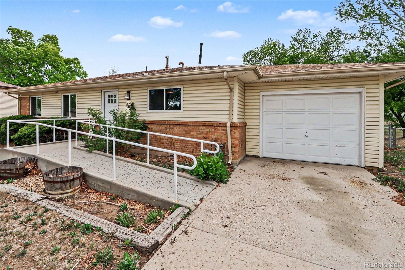 809 Gallup Road Fort Collins, CO 80521 - Photo 16 of 20 a view of a house with a wooden deck