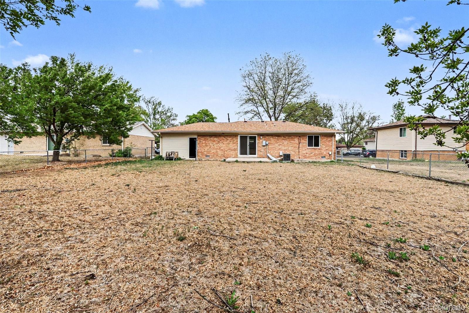809 Gallup Road Fort Collins, CO 80521 - Photo 18 of 20 a view of a house with a yard