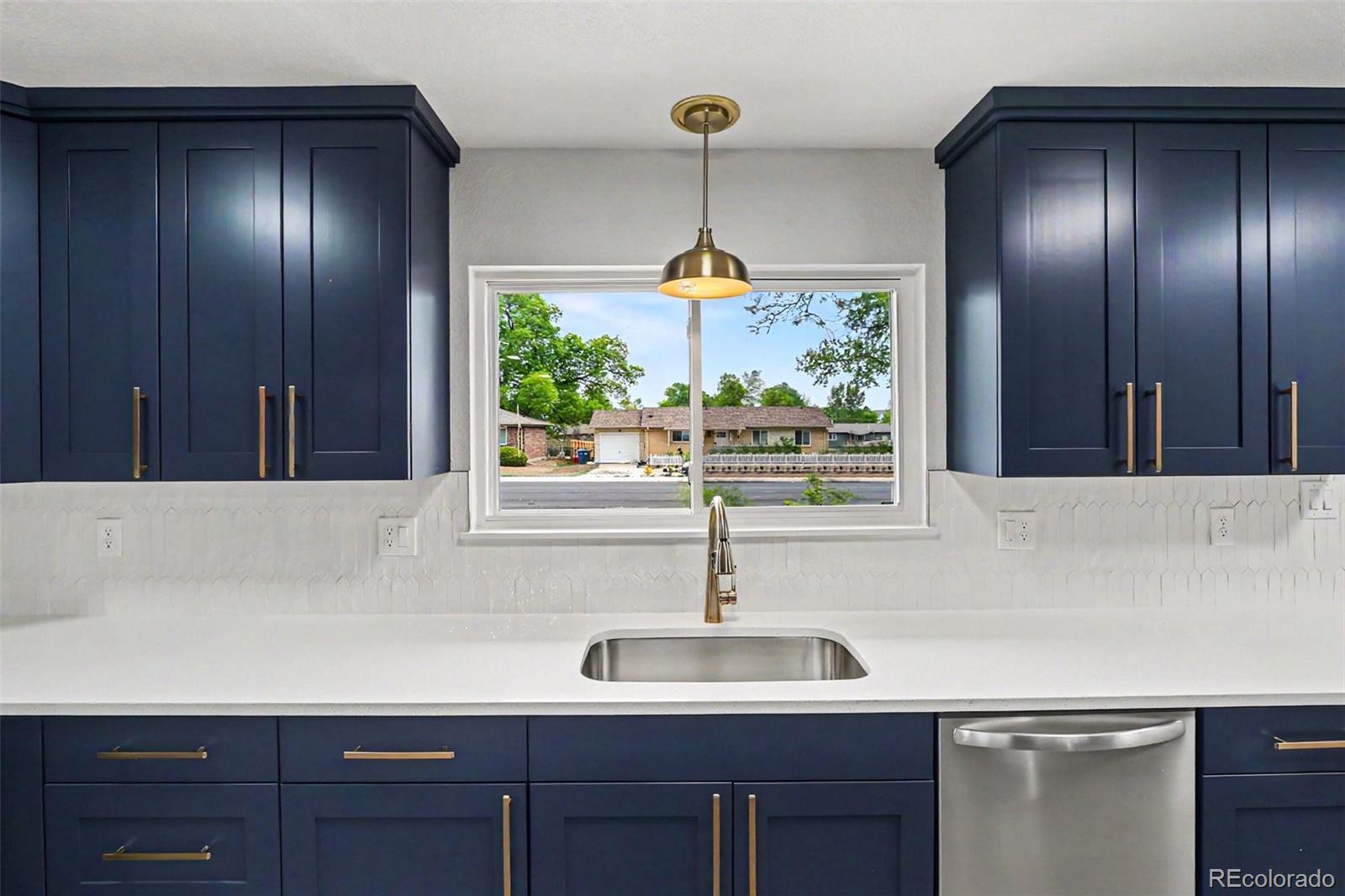 809 Gallup Road Fort Collins, CO 80521 - Photo 3 of 20 a kitchen with a sink and window