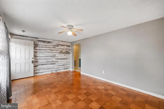 a view of an empty room with a window