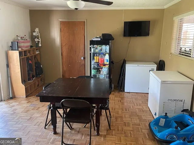a view of a dining room with furniture and wooden floor