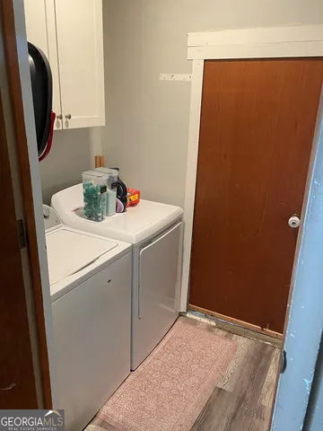 a utility room with a sink a washer and dryer