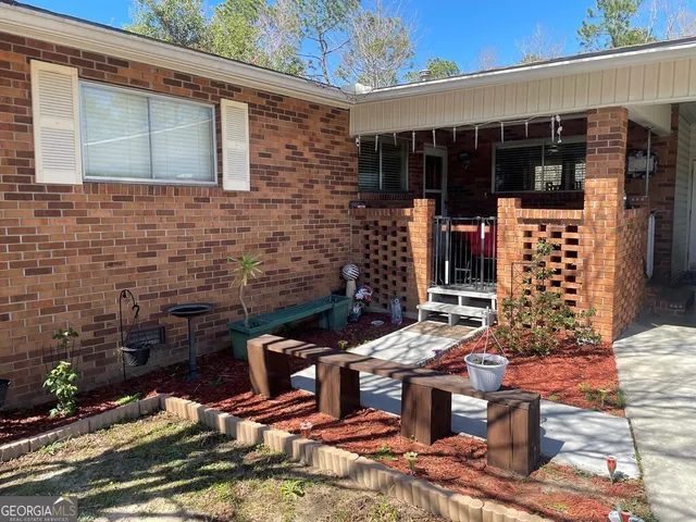 a view of backyard with outdoor seating