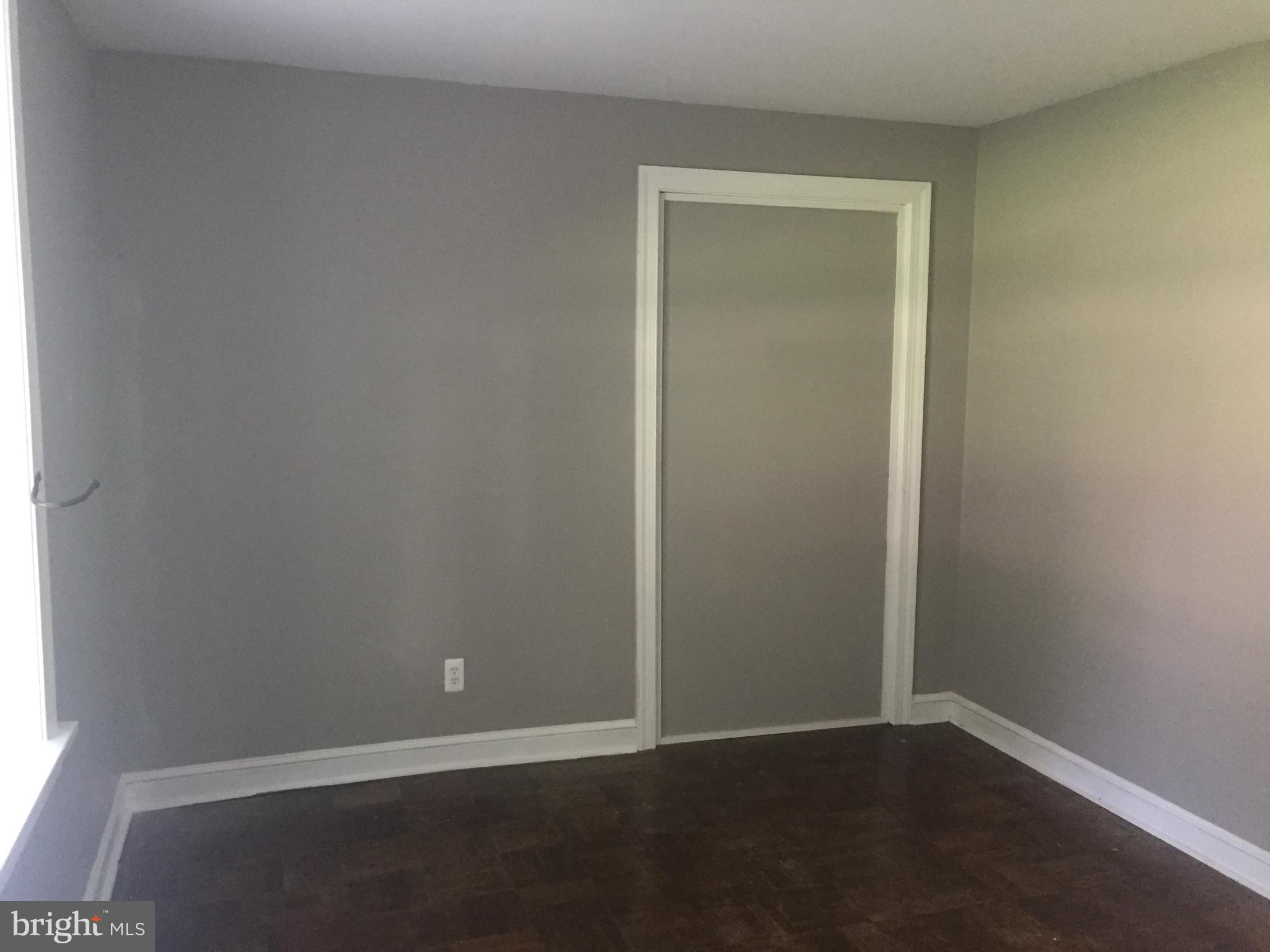 6357 Lancaster Avenue Philadelphia, PA 19151 - Photo 13 of 27 an empty room with wooden floor and closet