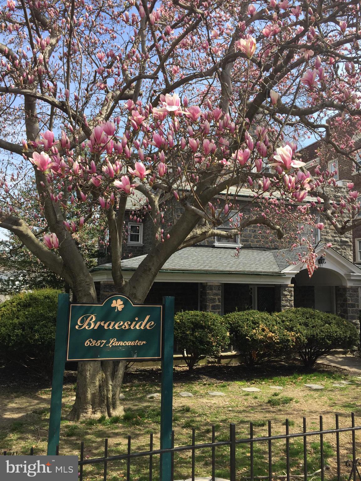 6357 Lancaster Avenue Philadelphia, PA 19151 - Photo 2 of 27 a front view of a house with garden