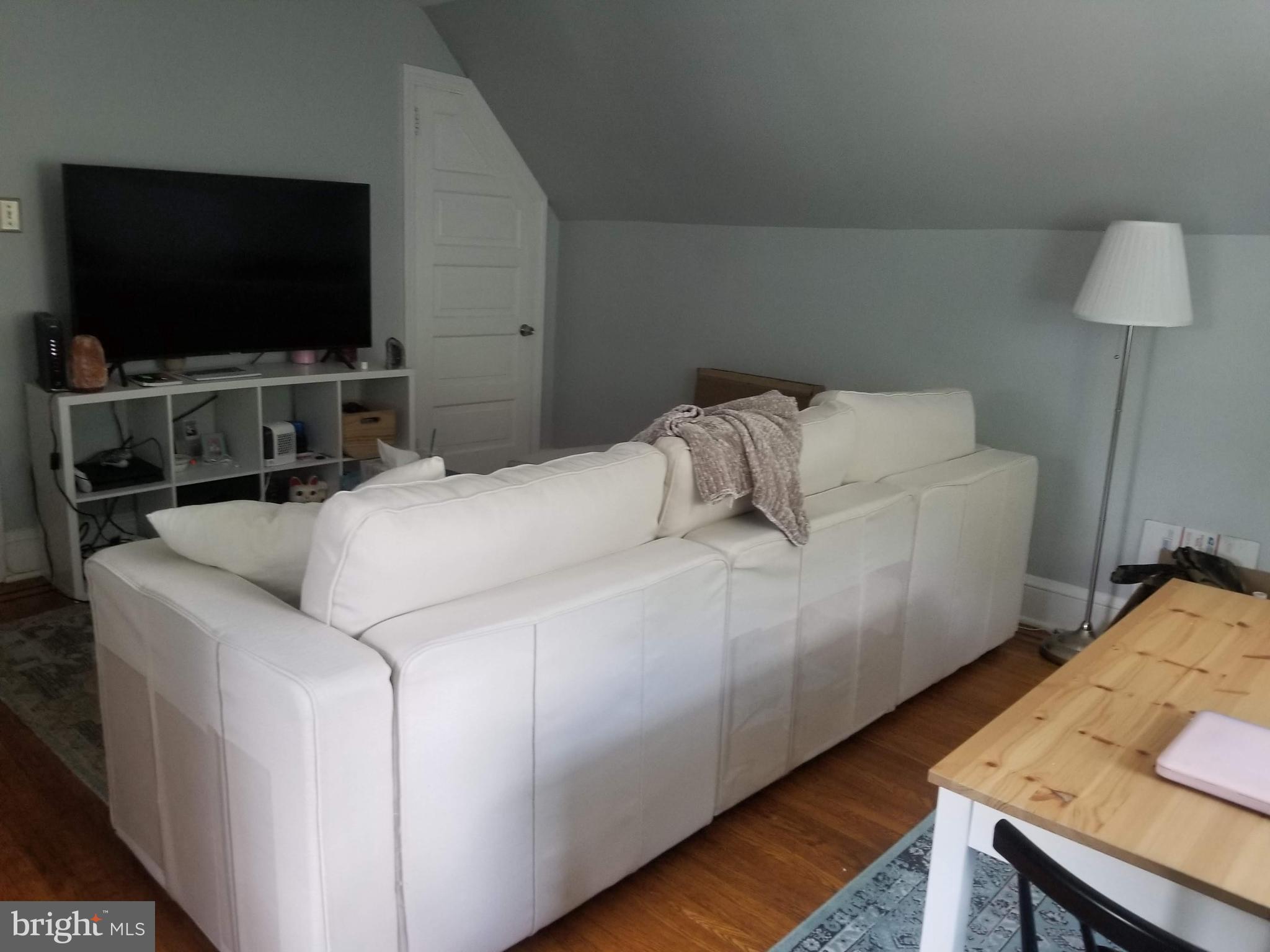 6357 Lancaster Avenue Philadelphia, PA 19151 - Photo 24 of 27 a bedroom with a bed and a flat screen tv