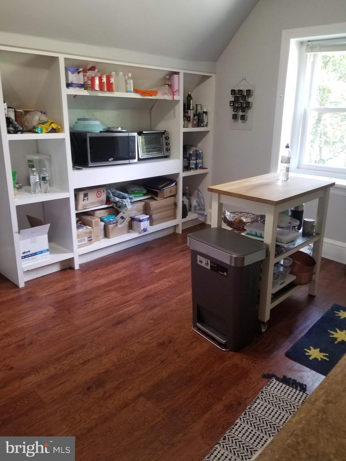 6357 Lancaster Avenue Philadelphia, PA 19151 - Photo 25 of 27 a room with furniture and a wooden floor