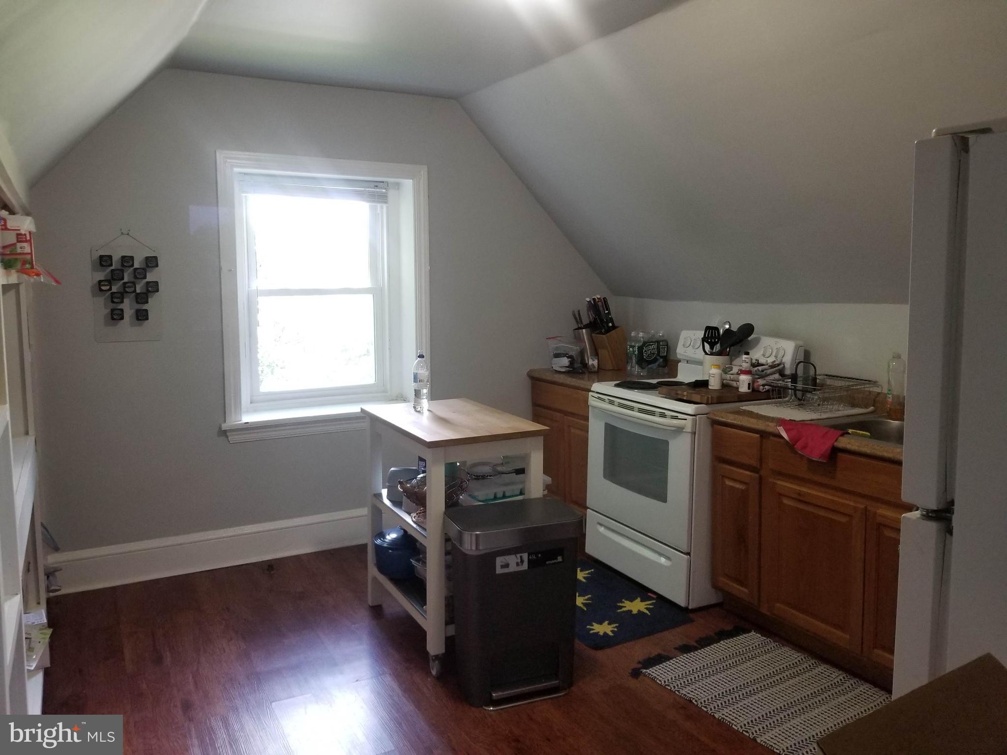 6357 Lancaster Avenue Philadelphia, PA 19151 - Photo 26 of 27 a kitchen with a stove and a window
