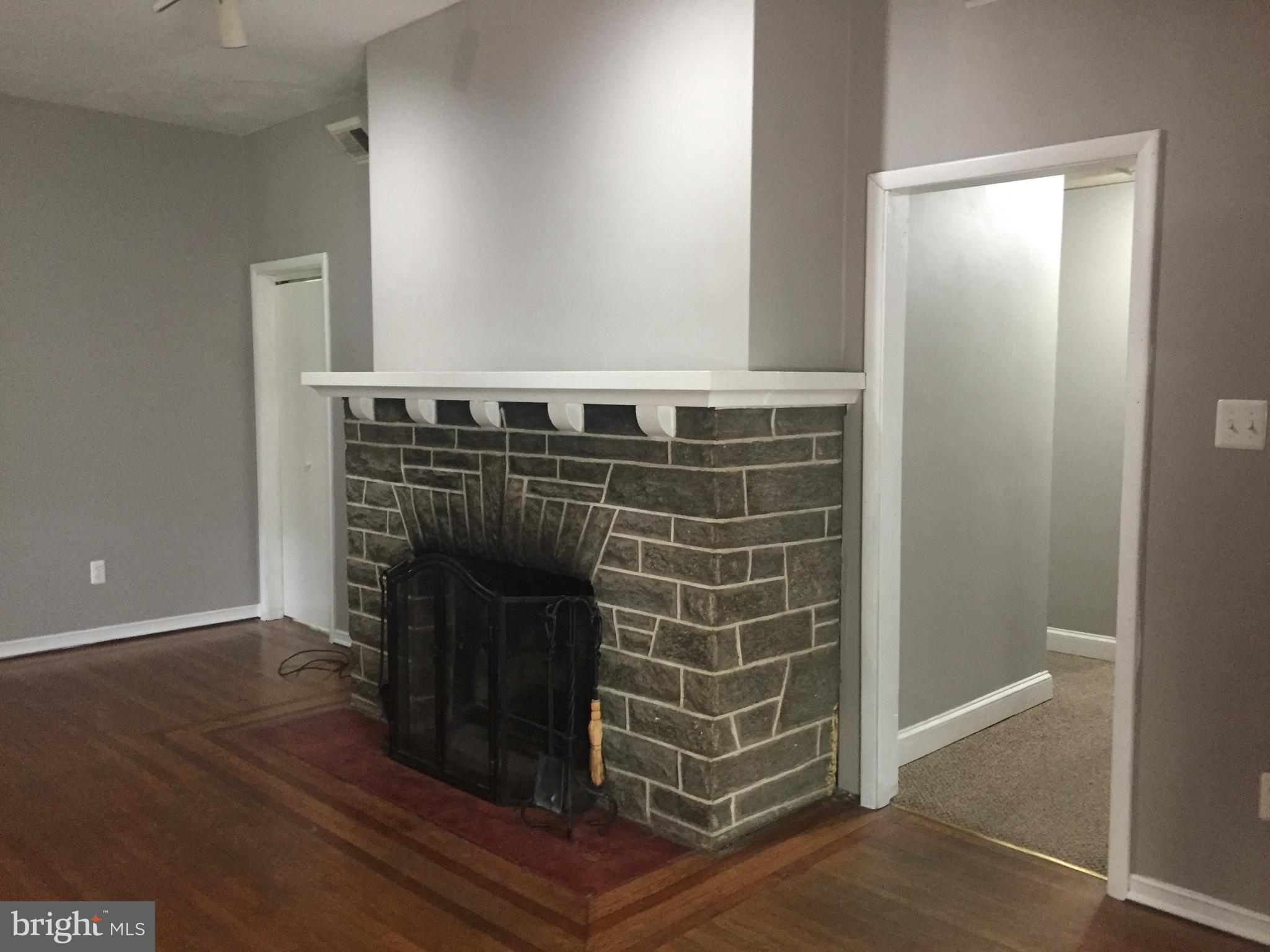 6357 Lancaster Avenue Philadelphia, PA 19151 - Photo 5 of 27 a view of fireplace with wooden floor