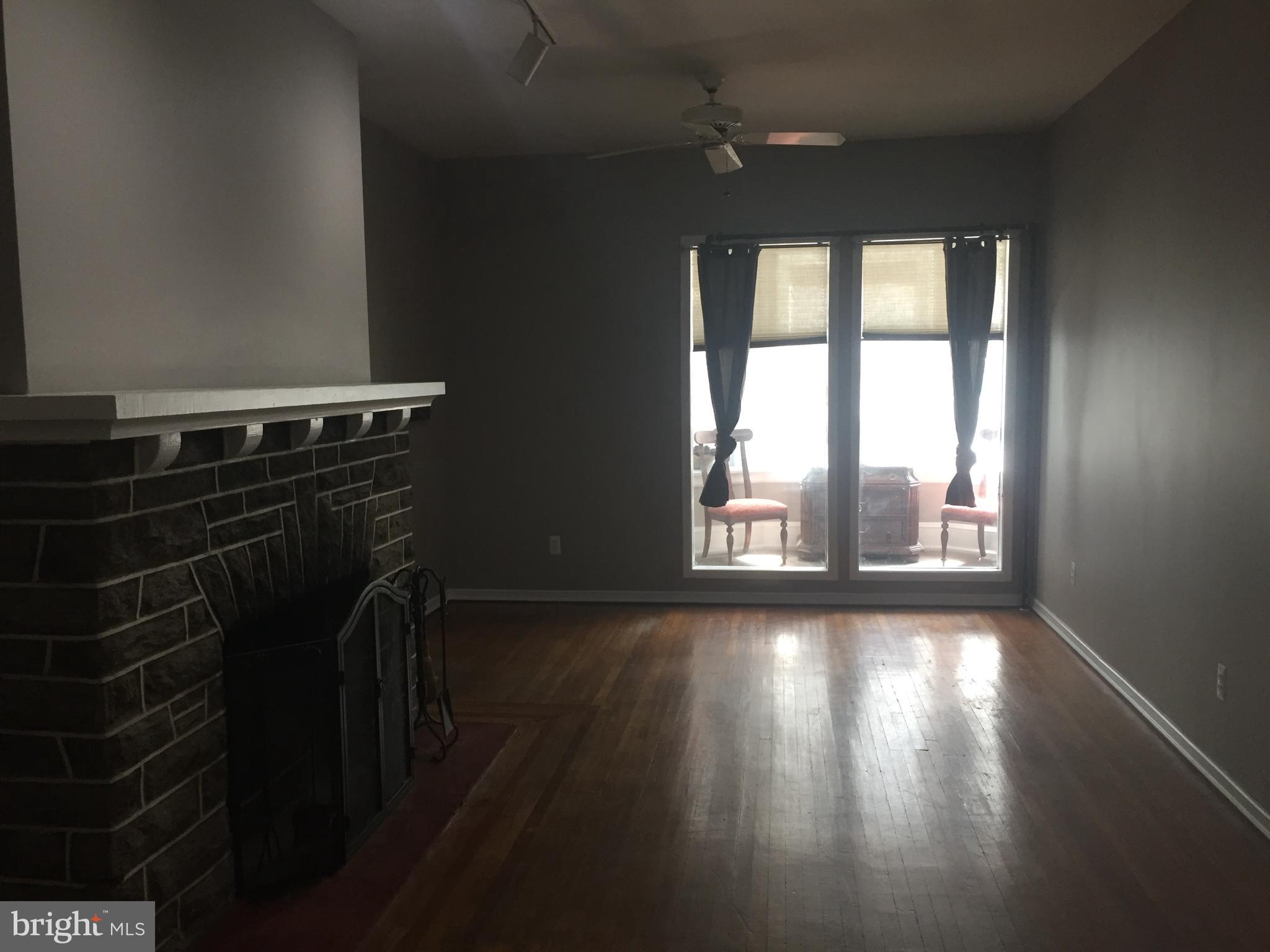 6357 Lancaster Avenue Philadelphia, PA 19151 - Photo 6 of 27 a view of a livingroom with wooden floor and a window