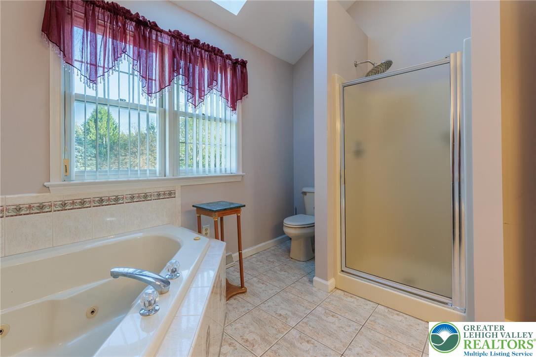 2170 Clearview Road Coplay, PA 18037 - Photo 38 of 75 Relax and refresh in this spacious bathroom featuring a soaking tub and tiled shower.