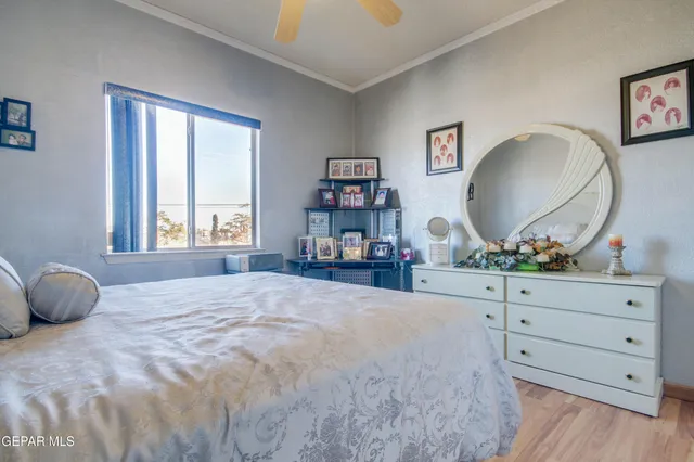 a spacious bedroom with a bed and a table