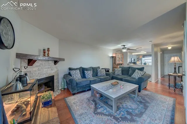 a living room with furniture and a fireplace