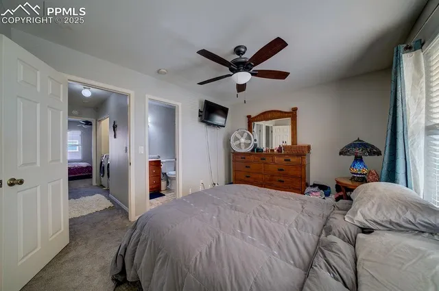 a bed room with a bed and a chandelier