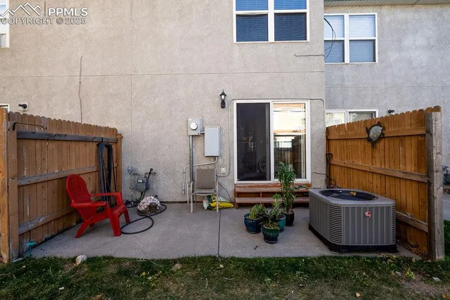 a view of a backyard with sitting area and furniture