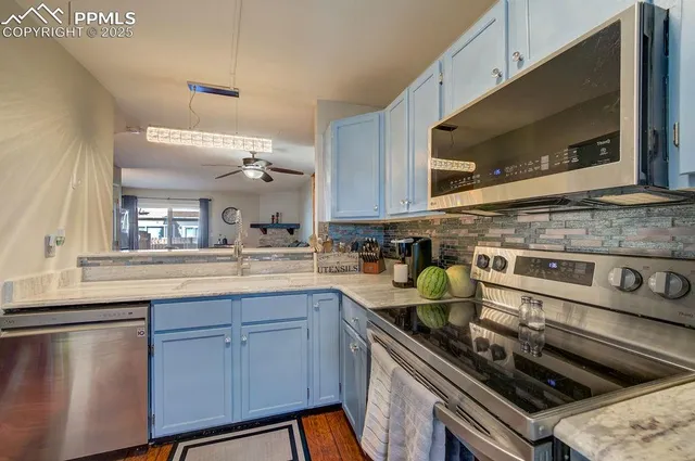 a kitchen with a stove and a microwave