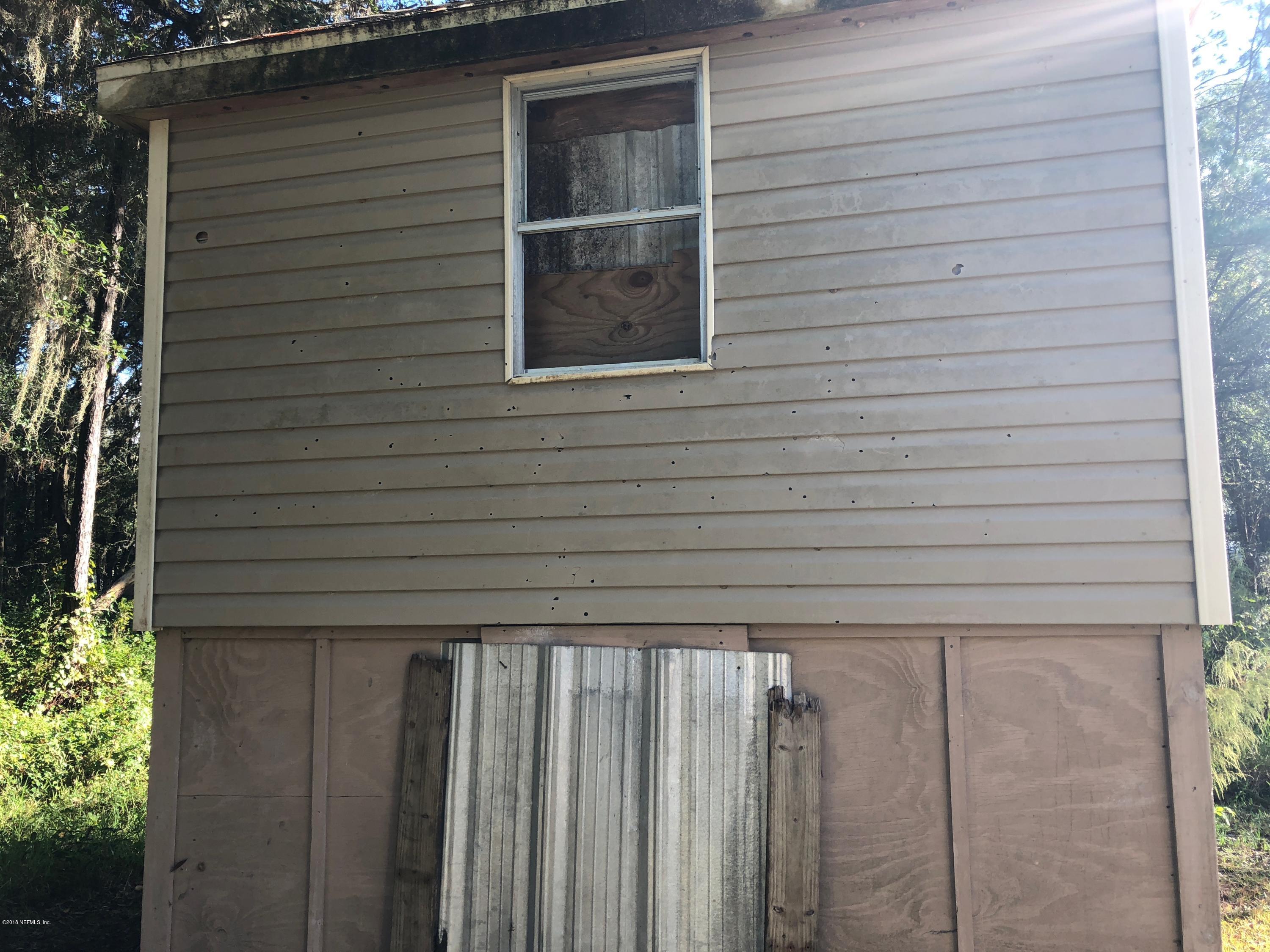 7140 Northeast 192 Place Citra, FL 32113 - Photo 3 of 10 a view of wooden door