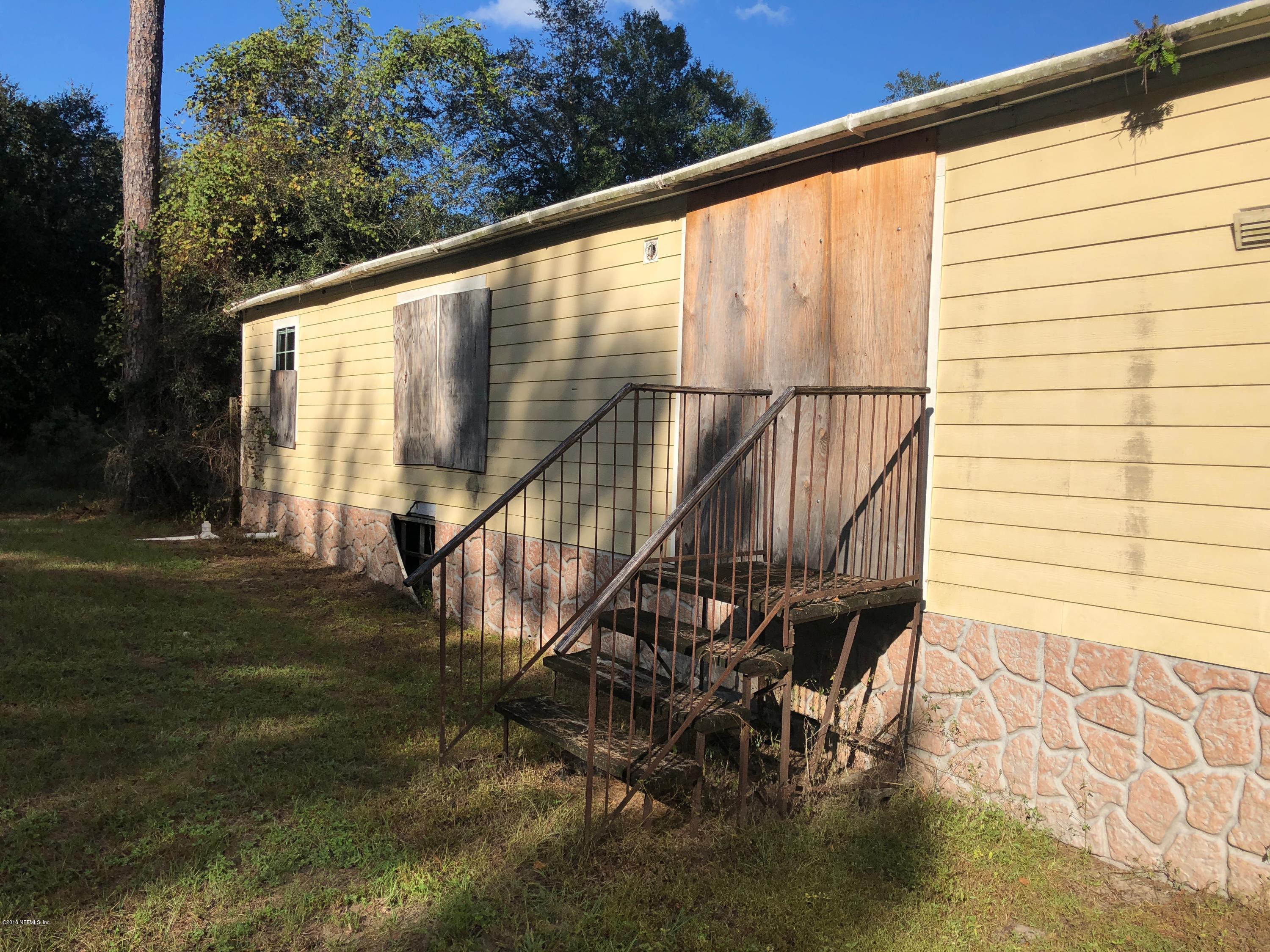 7140 Northeast 192 Place Citra, FL 32113 - Photo 4 of 10 a view of balcony with wooden floor and fence