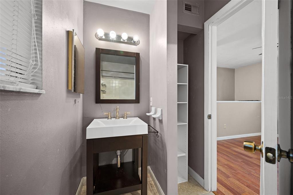 2508 Southwest 35th Place, Unit 51 Gainesville, FL 32608 - Photo 15 of 20 a bathroom with a sink and a mirror