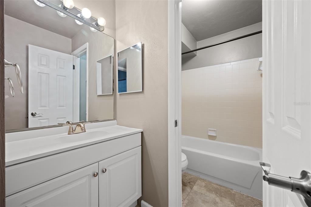 2508 Southwest 35th Place, Unit 151 Gainesville, FL 32608 - Photo 18 of 19 a bathroom with a sink and a mirror