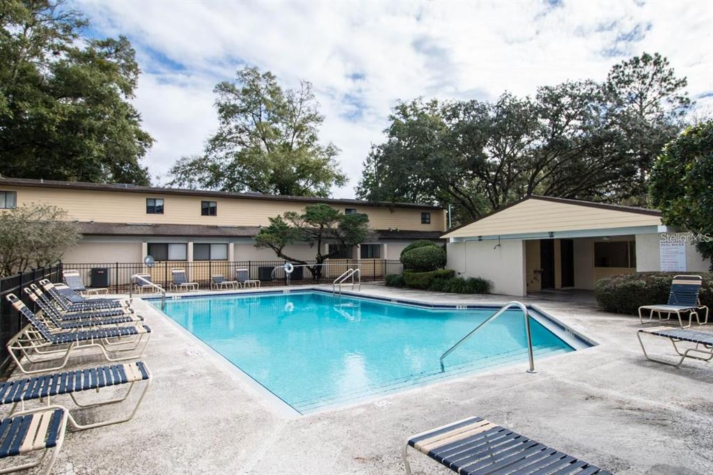 2508 Southwest 35th Place, Unit 51 Gainesville, FL 32608 - Photo 20 of 20 an outdoor space with swimming pool and furniture